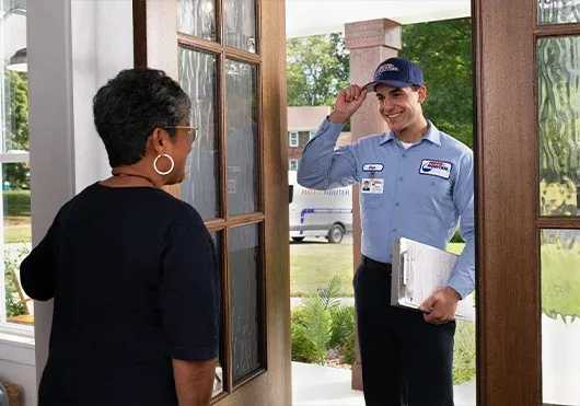 roto-rooter plumber with customer